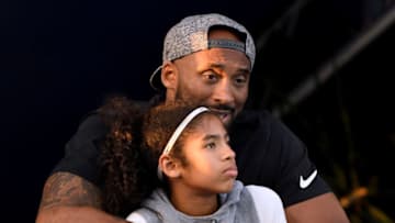 IRVINE, CA - JULY 26: Kobe Bryant and daughter Gianna Bryant watch during day 2 of the Phillips 66 National Swimming Championships at the Woollett Aquatics Center on July 26, 2018 in Irvine, California. (Photo by Harry How/Getty Images)