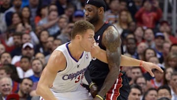 Feb 5, 2014; Los Angeles, CA, USA; Los Angeles Clippers forward Blake Griffin (32) is defended by Miami Heat forward LeBron James (6) at Staples Center. Mandatory Credit: Kirby Lee-USA TODAY Sports