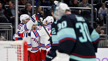 SEATTLE, WASHINGTON - NOVEMBER 17: Vincent Trocheck #16 of the New York Rangers celebrates with teammates after scoring during the third period against the Seattle Kraken at Climate Pledge Arena on November 17, 2022 in Seattle, Washington. The Seattle Kraken won in overtime 3-2. (Photo by Alika Jenner/Getty Images)