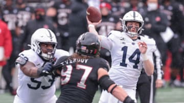 Dec 5, 2020; Piscataway, New Jersey, USA; Penn State quarterback Sean Clifford (14) throws the ball as Rutgers Scarlet Knights defensive lineman Mike Tverdov (97) is flicked by offensive lineman Rasheed Walker (53) during the first half at SHI Stadium. Mandatory Credit: Vincent Carchietta-USA TODAY Sports