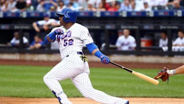 Jul 7, 2016; New York City, NY, USA; New York Mets center fielder Yoenis Cespedes (52) hits a single against the Washington Nationals during the first inning at Citi Field. Mandatory Credit: Brad Penner-USA TODAY Sports