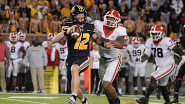Oct 1, 2022; Columbia, Missouri, USA; Missouri Tigers quarterback Brady Cook (12) is sacked by Georgia Bulldogs linebacker Nolan Smith (4) during the second half at Faurot Field at Memorial Stadium. Mandatory Credit: Denny Medley-USA TODAY Sports