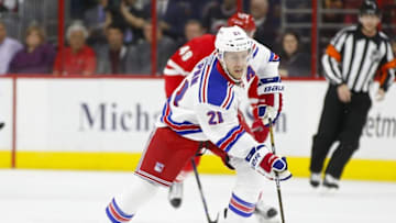 Mar 31, 2016; Raleigh, NC, USA; New York Rangers forward Derek Stepan (21) skates with the puck against the Carolina Hurricanes at PNC Arena. The Hurricanes won 4-3. Mandatory Credit: James Guillory-USA TODAY Sports