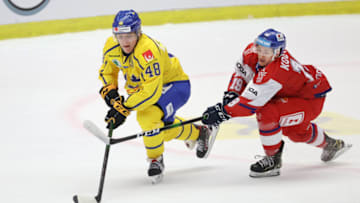 Sweden's Jonatan Berggren (L) and Czech Republic's Petr Kodytek fight for the puck during the Beijer Hockey Games (Euro Hockey Tour) ice hockey match between Czech Republic and Sweden at Malmo Arena in Malmo, Sweden, on February 11, 2021. (Photo by Andreas HILLERGREN / TT News Agency / AFP) / Sweden OUT (Photo by ANDREAS HILLERGREN/TT News Agency/AFP via Getty Images)