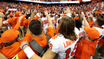 SYRACUSE, NEW YORK - SEPTEMBER 14: Trevor Lawrence #16 of the Clemson Tigers joins his team after winning a game against the Syracuse Orange at the Carrier Dome on September 14, 2019 in Syracuse, New York. (Photo by Bryan M. Bennett/Getty Images)