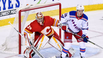 CALGARY, AB - MARCH 15: Calgary Flames Goalie David Rittich (33) looks around a screen made by New York Rangers Right Wing Jimmy Vesey (26) during the third period of an NHL game where the Calgary Flames hosted the New York Rangers on March 15, 2019, at the Scotiabank Saddledome in Calgary, AB. (Photo by Brett Holmes/Icon Sportswire via Getty Images)