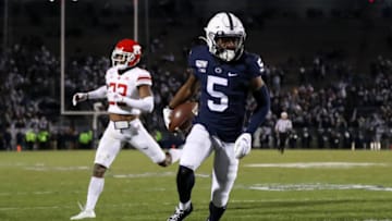 Nov 30, 2019; University Park, PA, USA; Penn State Nittany Lions wide receiver Jahan Dotson (5) runs the ball into the end zone for a touchdown during the fourth quarter against the Rutgers Scarlet Knights at Beaver Stadium. Penn State defeated Rutgers 27-6. Mandatory Credit: Matthew O'Haren-USA TODAY Sports