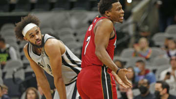 Derrick White #4 of the San Antonio Spurs listens as Kyle Lowry #7 of the Miami Heat argues a call(Photo by Ronald Cortes/Getty Images)