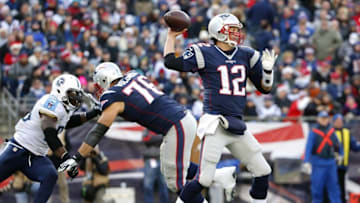 Dec 20, 2015; Foxborough, MA, USA; New England Patriots quarterback Tom Brady (12) throws as tackle Sebastian Vollmer (76) blocks Tennessee Titans outside linebacker Brian Orakpo (98) during the second half of the New England Patriots 33-16 win over the Tennessee Titans at Gillette Stadium. Mandatory Credit: Winslow Townson-USA TODAY Sports