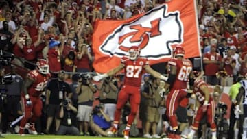 Sep 29, 2014; Kansas City, MO, USA; Kansas City Chiefs tight end Travis Kelce (87) celebrates with nose tackle Dontari Poe (92) and tackle Ryan Harris (68) after scoring a touchdown against the New England Patriots in the second half at Arrowhead Stadium. Kansas City won 41-14. Mandatory Credit: John Rieger-USA TODAY Sports