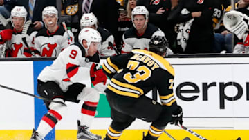 BOSTON, MA - OCTOBER 12: New Jersey Devils left wing Taylor Hall (9) tries to get past Boston Bruins right defenseman Charlie McAvoy (73) during a game between the Boston Bruins and the New Jersey Devils on October 12, 2019, at TD Garden in Boston, Massachusetts. (Photo by Fred Kfoury III/Icon Sportswire via Getty Images)