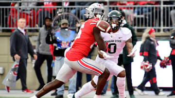 COLUMBUS, OHIO - NOVEMBER 20: Keon Coleman #0 of the Michigan State Spartans catches a pass against Ryan Watts #16 of the Ohio State Buckeyes for a touchdown during the second half of a game at Ohio Stadium on November 20, 2021 in Columbus, Ohio. (Photo by Emilee Chinn/Getty Images)