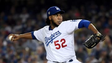 LOS ANGELES, CA - OCTOBER 26: Pedro Baez #52 of the Los Angeles Dodgers delivers the pitch against the Boston Red Sox during the tenth inning in Game Three of the 2018 World Series at Dodger Stadium on October 26, 2018 in Los Angeles, California. (Photo by Harry How/Getty Images)