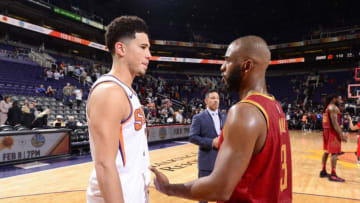 PHOENIX, AZ - FEBRUARY 4: Devin Booker #1 of the Phoenix Suns and Chris Paul #3 of the Houston Rockets talk after the game on February 4. 2019 at Talking Stick Resort Arena in Phoenix, Arizona. NOTE TO USER: User expressly acknowledges and agrees that, by downloading and/or using this photograph, user is consenting to the terms and conditions of the Getty Images License Agreement. Mandatory Copyright Notice: Copyright 2019 NBAE (Photo by Barry Gossage/NBAE via Getty Images)