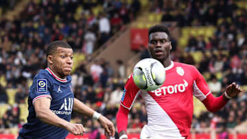 Paris Saint-Germain's French forward Kylian Mbappe (L) fights for the ball with Monaco's French defender Benoit Badiashile Mukinayi during the French L1 football match between AS Monaco and Paris Saint Germain (PSG) at the Louis II Stadium (Stade Louis II) in the Principality of Monaco on March 20, 2022. (Photo by Valery HACHE / AFP) (Photo by VALERY HACHE/AFP via Getty Images)