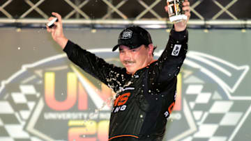 BRISTOL, TENNESSEE - AUGUST 15: Brett Moffitt, driver of the #24 Midnight Moon Moonshine Chevrolet, celebrates in Victory Lane after winning the NASCAR Gander Outdoor Truck Series UNOH 200 presented by Ohio Logistics at Bristol Motor Speedway on August 15, 2019 in Bristol, Tennessee. (Photo by Jared C. Tilton/Getty Images)