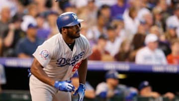 DENVER, CO - AUGUST 11: Yasiel Puig #66 of the Los Angeles Dodgers flips his bat on a single in the seventh inning at Coors Field on August 11, 2018 in Denver, Colorado. (Photo by Joe Mahoney/Getty Images)
