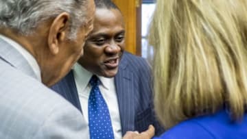 WASHINGTON, DC - JANUARY 12: Forensic pathologist and neuropathologist Dr. Bennet Omalu is greeted by members of Congress before participating in a briefing sponsored by Rep. Jackie Speier (D-CA) on Capitol Hill on January 12, 2016 in Washington, DC. Dr.Omalu is credited with discovering chronic traumatic encephalopathy, or CTE, in former NFL players. (Photo by Pete Marovich/Getty Images)