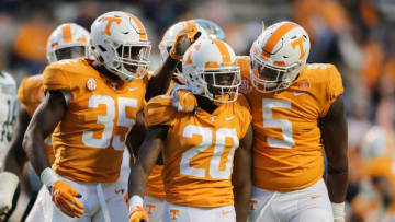 KNOXVILLE, TN - NOVEMBER 3: Linebacker Daniel Bituli #35 of the Tennessee Volunteers, Defensive back Bryce Thompson #20 of the Tennessee Volunteers, and Defensive lineman Kyle Phillips #5 of the Tennessee Volunteers react to a play during the game between the Charlotte 49ers and the Tennessee Volunteers at Neyland Stadium on November 3, 2018 in Knoxville, Tennessee. Tennessee won the game 14-3. (Photo by Donald Page/Getty Images)