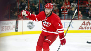 Nov 16, 2015; Raleigh, NC, USA; Carolina Hurricanes defensemen Noah Hanifin (5) is congratulated by teammates after his 2nd period goal against the Anaheim Ducks at PNC Arena. Mandatory Credit: James Guillory-USA TODAY Sports