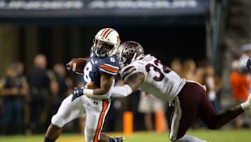 AUBURN, AL - SEPTEMBER 28: Running back Shaun Shivers #8 of the Auburn Tigers looks to run the ball by safety Brian Cole II #32 of the Mississippi State Bulldogs during the third quarter at Jordan-Hare Stadium on September 28, 2019 in Auburn, AL. (Photo by Michael Chang/Getty Images)