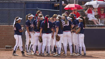 TUCSON, AZ - MAY 18: The Arizona Wildcats huddle during the sixth inning while playing the LSU Tigers in the Tucson Regional of the 2014 NCAA Softball Tournament at Hillenbrand Memorial Stadium on May 18, 2014 in Tucson, Arizona. (Photo by Jacob Funk/J and L Photography/Getty Images )