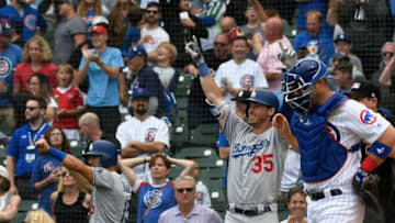 CHICAGO, IL - JUNE 19: Cody Bellinger #35 of the Los Angeles Dodgers and Austin Barnes #15 of the Los Angeles Dodgers after the Dodgers took the lead against the Chicago Cubs during the ninth inning in game one of a doubleheader on June 19, 2018 at Wrigley Field in Chicago, Illinois. The Dodgers won 4-3. (Photo by David Banks/Getty Images)