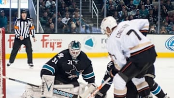 Dec 29, 2013; San Jose, CA, USA; San Jose Sharks goalie Antti Niemi (31) blocks a shot by Anaheim Ducks center Andrew Cogliano (7) during the second period at SAP Center at San Jose. The San Jose Sharks defeated the Anaheim Ducks 3-1. Mandatory Credit: Ed Szczepanski-USA TODAY Sports