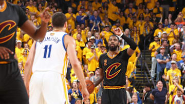 OAKLAND, CA - JUNE 12: Kyrie Irving #2 of the Cleveland Cavaliers dribbles the ball and calls a play against the Golden State Warriors in Game Five of the 2017 NBA Finals on June 12, 2017 at Oracle Arena in Oakland, California. NOTE TO USER: User expressly acknowledges and agrees that, by downloading and or using this photograph, user is consenting to the terms and conditions of Getty Images License Agreement. Mandatory Copyright Notice: Copyright 2017 NBAE (Photo by Nathaniel S. Butler/NBAE via Getty Images)