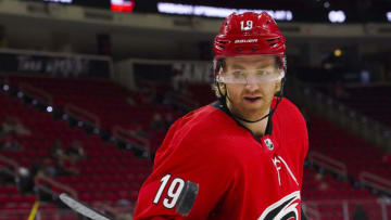 Carolina Hurricanes defenseman Dougie Hamilton (19) bounces the puck on his stick before the game against the Dallas Stars at PNC Arena. Mandatory Credit: James Guillory-USA TODAY Sports
