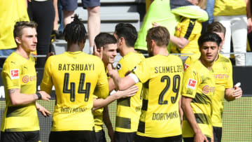 Dortmund's US midfielder Christian Pulisic (3rd L) celebrates with his team-mates during the German first division Bundesliga football match Borussia Dortmund vs VfB Stuttgart, in Dortmund, western Germany, on April 8, 2018. / AFP PHOTO / Patrik STOLLARZ / RESTRICTIONS: DURING MATCH TIME: DFL RULES TO LIMIT THE ONLINE USAGE TO 15 PICTURES PER MATCH AND FORBID IMAGE SEQUENCES TO SIMULATE VIDEO. == RESTRICTED TO EDITORIAL USE == FOR FURTHER QUERIES PLEASE CONTACT DFL DIRECTLY AT 49 69 650050 (Photo credit should read PATRIK STOLLARZ/AFP/Getty Images)
