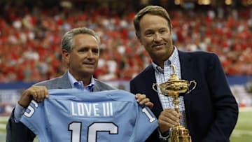 Sep 3, 2016; Atlanta, GA, USA; Davis Love III stands with the Ryder Cup Trophy and is presented with jerseys after the first quarter of the 2016 Chick-Fil-A Kickoff game between the Georgia Bulldogs and the North Carolina Tar Heels at Georgia Dome. Mandatory Credit: Jason Getz-USA TODAY Sports