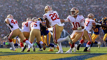 LOS ANGELES, CA - DECEMBER 31: Jimmy Garoppolo #10 hands off to Carlos Hyde #28 of the San Francisco 49ers during the second half of a game against the Los Angeles Rams at Los Angeles Memorial Coliseum on December 31, 2017 in Los Angeles, California. (Photo by Sean M. Haffey/Getty Images)