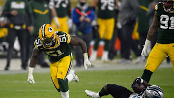 GREEN BAY, WISCONSIN - DECEMBER 19: Inside linebacker Krys Barnes #51 of the Green Bay Packers celebrates after tackling running back Mike Davis #28 of the Carolina Panthers for a loss of yard in the third quarter of the game at Lambeau Field on December 19, 2020 in Green Bay, Wisconsin. (Photo by Quinn Harris/Getty Images)