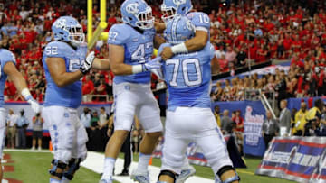 Sep 3, 2016; Atlanta, GA, USA; North Carolina Tar Heels quarterback Mitch Trubisky (10) celebrates a touchdown with teammates against the Georgia Bulldogs during the second quarter of the 2016 Chick-Fil-A Kickoff game at Georgia Dome. Mandatory Credit: Brett Davis-USA TODAY Sports