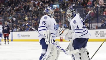 Apr 8, 2015; Columbus, OH, USA; Toronto Maple Leafs goalie Jonathan Bernier (45) enters the game as goalie James Reimer (34) exits against the Columbus Blue Jackets in the second period at Nationwide Arena. Mandatory Credit: Aaron Doster-USA TODAY Sports