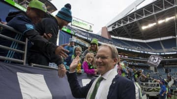 Oct 23, 2016; Seattle, WA, USA; Seattle Sounders FC head coach Brian Schmetzer high-fives fans as he leaves the pitch after a game against the Real Salt Lake at CenturyLink Field. Seattle won 2-1. Mandatory Credit: Jennifer Buchanan-USA TODAY Sports