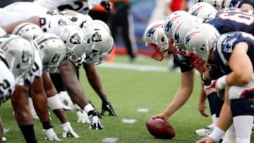 Sep 21, 2014; Foxborough, MA, USA; the New England Patriots and the Oakland Raiders get set for the snap at the line of scrimmage during the second quarter at Gillette Stadium. Mandatory Credit: Winslow Townson-USA TODAY Sports
