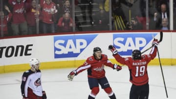 WASHINGTON, DC - APRIL 21:Washington Capitals right wing T.J. Oshie (77) and Washington Capitals center Nicklas Backstrom (19) celebrate after backstroke scores the winning goal during the fourth period of Game 5 of the First Round of the Stanley Cup Playoffs between the Washington Capitals and the Columbus Blue Jackets at the Capital One Arena on Saturday, April 21, 2018. The Washington Capitals defeated yeh Columbus Blue Jackets to go up 3-2 in the series. (Photo by Toni L. Sandys/The Washington Post via Getty Images)