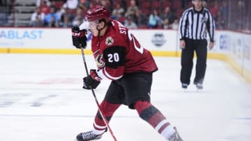Oct 2, 2015; Glendale, AZ, USA; Arizona Coyotes center Dylan Strome (20) passes the puck during the second period against the San Jose Sharks at Gila River Arena. Mandatory Credit: Matt Kartozian-USA TODAY Sports