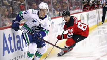 NEWARK, NEW JERSEY - OCTOBER 19: Quinn Hughes #43 of the Vancouver Canucks skates against Jack Hughes #86 of the New Jersey Devils during the third period at the Prudential Center on October 19, 2019 in Newark, New Jersey. The Devils shut-out the Canucks 1-0. (Photo by Bruce Bennett/Getty Images)