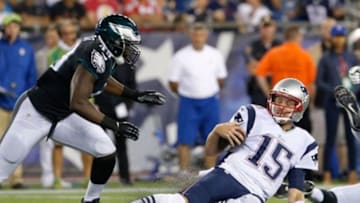 Aug 15, 2014; Foxborough, MA, USA; New England Patriots quarterback Ryan Mallett (15) runs the ball against Philadelphia Eagles linebacker Josh Kaddu (49) in the second half during the preseason game at Gillette Stadium. The New England Patriots defeated the Philadelphia Eagles 42-35. Mandatory Credit: David Butler II-USA TODAY Sports