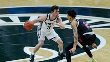 Michigan State guard Foster Loyer dribbles against Nebraska guard Trey McGowens during the first half at Breslin Center in East Lansing, Saturday, Feb. 6, 2021.