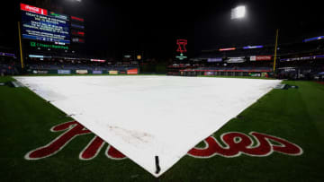 PHILADELPHIA, PENNSYLVANIA - OCTOBER 31: The tarp covers the field following the postponement of Game Three of the 2022 World Series between the Philadelphia Phillies and Houston Astros at Citizens Bank Park on October 31, 2022 in Philadelphia, Pennsylvania. (Photo by Al Bello/Getty Images)