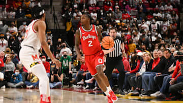 Feb 27, 2022; College Park, Maryland, USA; Ohio State Buckeyes guard Cedric Russell (2) dribbles as Maryland Terrapins guard Ian Martinez (23) defends during the first half at Xfinity Center. Mandatory Credit: Tommy Gilligan-USA TODAY Sports