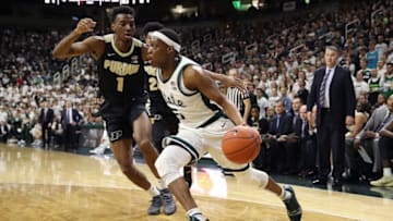 EAST LANSING, MICHIGAN - JANUARY 08: Cassius Winston #5 of the Michigan State Spartans drives around Aaron Wheeler #1 of the Purdue Boilermakers during the first half at Breslin Center on January 08, 2019 in East Lansing, Michigan. (Photo by Gregory Shamus/Getty Images)