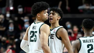COLLEGE PARK, MARYLAND - FEBRUARY 01: Malik Hall #25 of the Michigan State Spartans celebrates with Max Christie #5 after scoring the game winning basket late in the second half against the Maryland Terrapins at Xfinity Center on February 01, 2022 in College Park, Maryland. Michigan State won the game 65-63. (Photo by Greg Fiume/Getty Images)