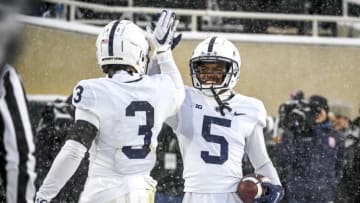EAST LANSING, MICHIGAN - NOVEMBER 27: Parker Washington #3 and Jahan Dotson #5 of the Penn State Nittany Lions celebrate after Dotson scored a touchdown against the Michigan State Spartans during the second quarter at Spartan Stadium on November 27, 2021 in East Lansing, Michigan. (Photo by Nic Antaya/Getty Images)