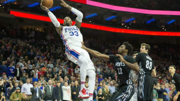 Jan 3, 2017; Philadelphia, PA, USA; Philadelphia 76ers forward Robert Covington (33) hits the game winning shot past Minnesota Timberwolves forward Andrew Wiggins (22) with 0.2 seconds left at Wells Fargo Center. The Philadelphia 76ers won 93-91. Mandatory Credit: Bill Streicher-USA TODAY Sports