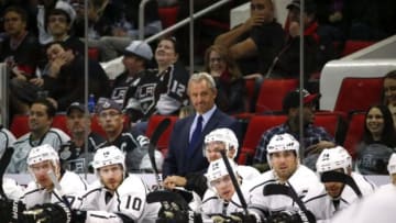 Nov 2, 2014; Raleigh, NC, USA; Los Angeles Kings head coach Darryl Sutter (c) looks on against the Carolina Hurricanes at PNC Arena. Carolina defeated Los Angeles 3-2. Mandatory Credit: James Guillory-USA TODAY Sports